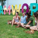 Girls sitting in front of Tamworth sign 